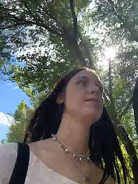 dollytall (F young) - Topless under jacket in middle of park